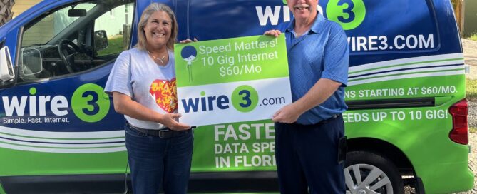 Wire3 customer holding a prize