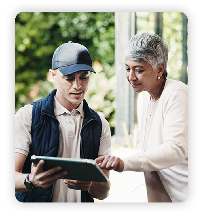 Wire 3 employee helping older woman with internet install